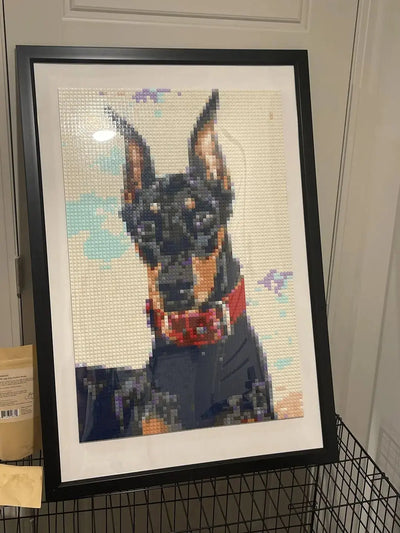 A finished brick mosaic of a Doberman in a black frame